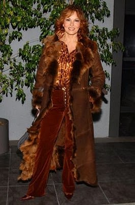 Raquel Welch in a floor length fur lined coat